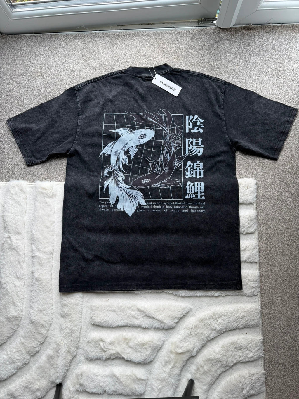 Vintage Dressing black and grey acid wash graphic tee featuring koi fish design.