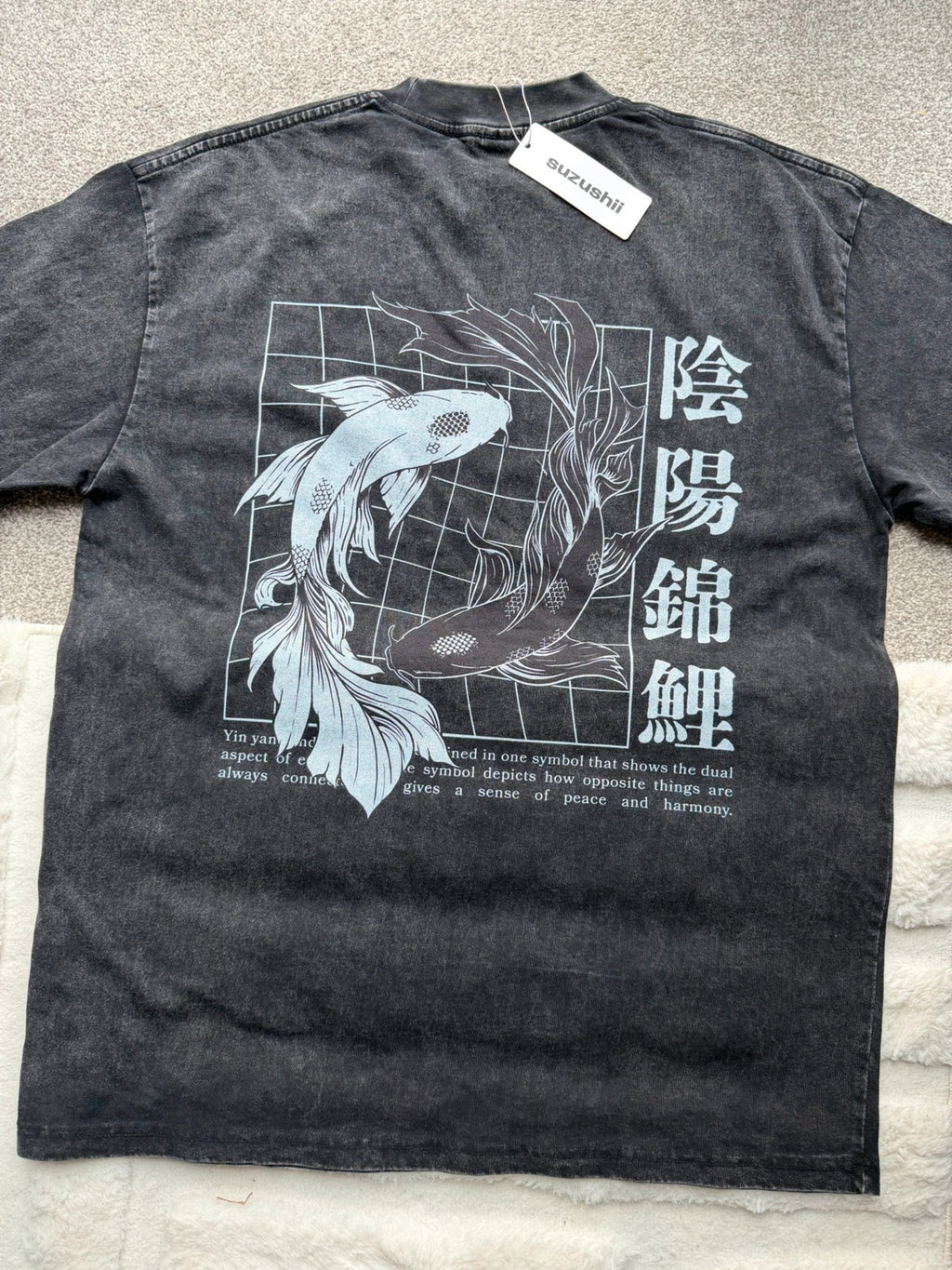 Vintage Dressing black and grey acid wash graphic tee featuring koi fish design.