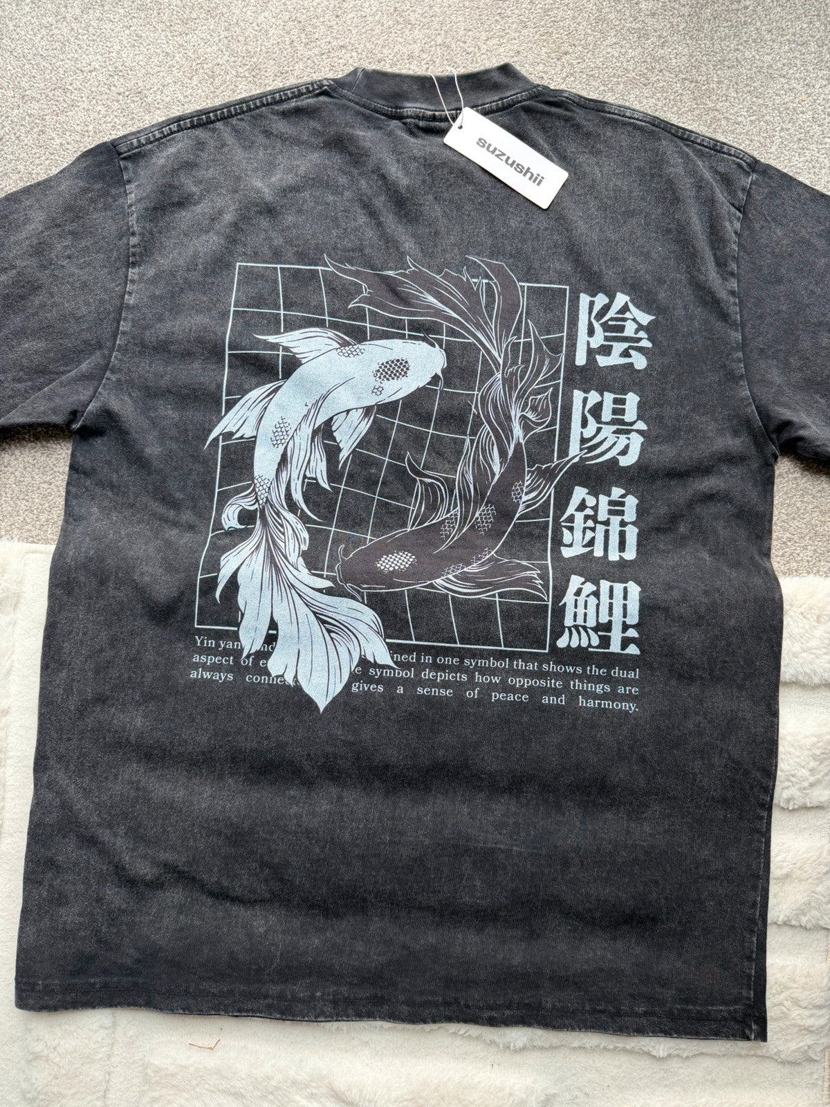Vintage Dressing black and grey acid wash graphic tee featuring koi fish design.