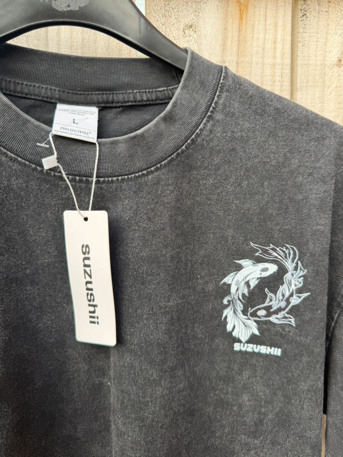 Vintage Dressing black and grey acid wash graphic tee featuring koi fish design.